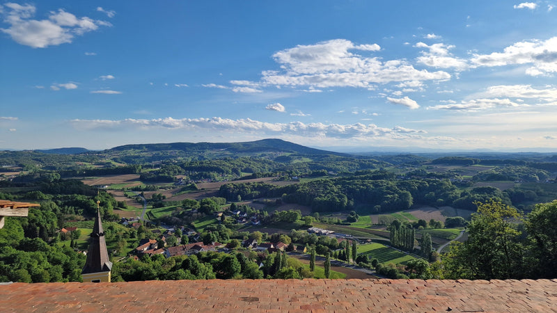 The Schloss Kapfenstein terrace view over Vulkanland toward Slovenia, where Margot's day in volcano country ended.