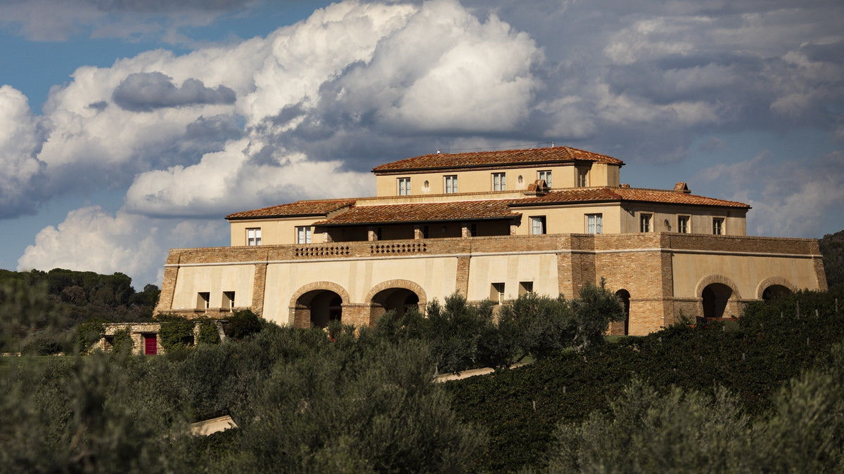 Tenuta Argentiera's winery built low into the Bolgheri hillside under a wide coastal sky. Image: Courtesy of Tenuta Argentiera, photo Moggi.
