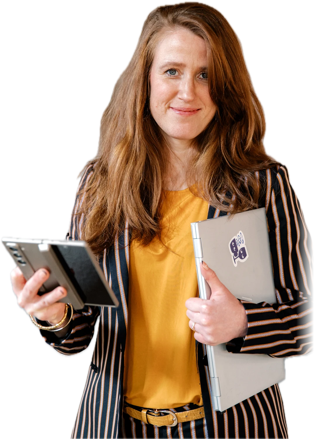 Margot van Lieshout with a phone in one hand and her laptop under the other arm, ready to get to work